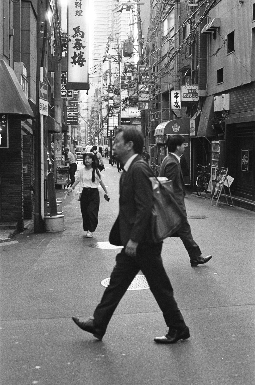 A Japanese street crossing, black and white film photograph