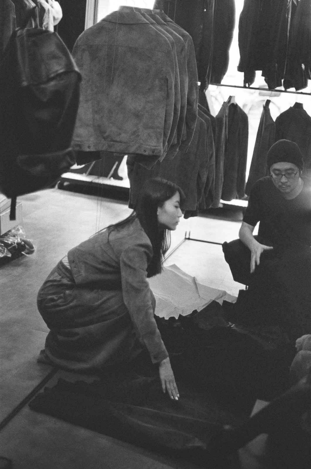 Inside the atelier — leather jackets examined on the floor